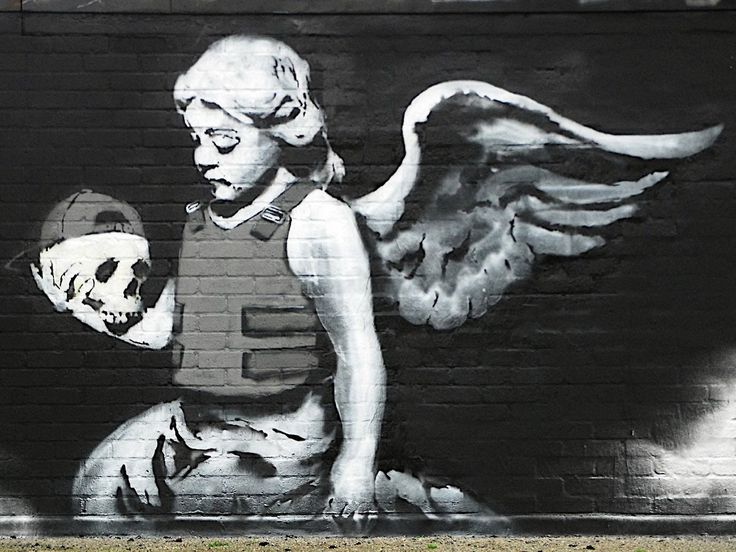 Arte urbano de Londres: Cherub with a bullet proof vest, Banksy