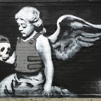 Cherub with a bullet proof vest, Banksy